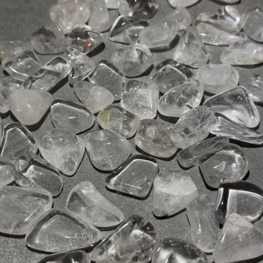 rock crystal with transparent and clear surfaces, photographed against a white background